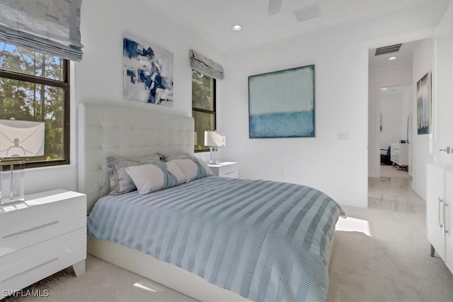 bedroom with recessed lighting, visible vents, and light colored carpet