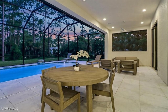 interior space featuring a lanai, an outdoor pool, and an outdoor living space