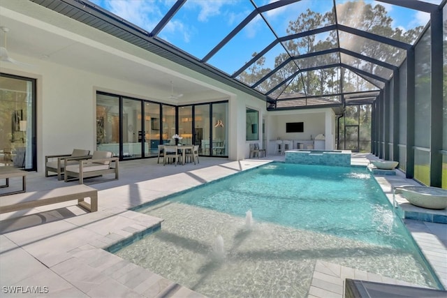 view of swimming pool with a lanai, a pool with connected hot tub, and a patio