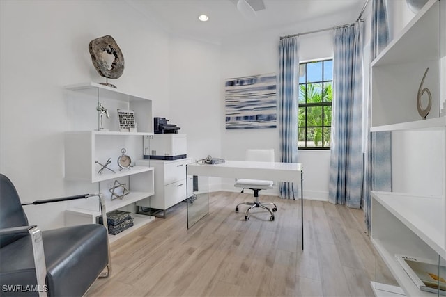 office space featuring light wood-style floors and recessed lighting