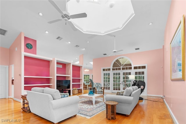 living room featuring ceiling fan and wood-type flooring