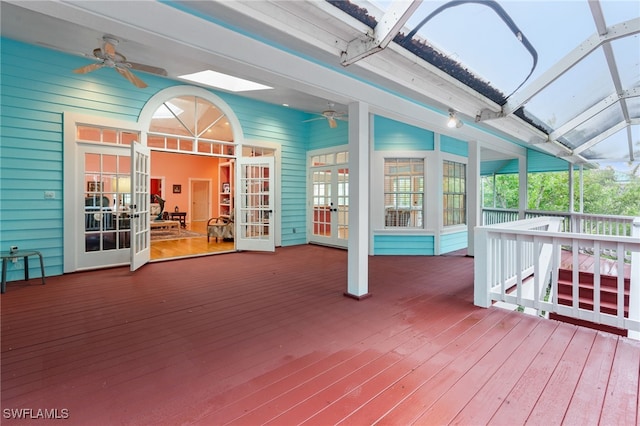 deck with french doors and ceiling fan