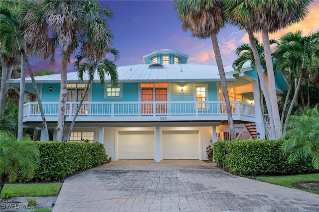 raised beach house with a garage