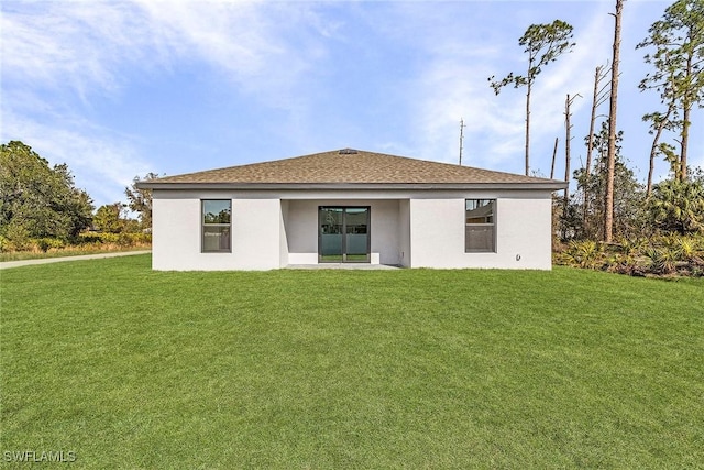 826 Yellowbird Dr, Fort Myers, FL 33913 - rear view of property with roof with shingles, a yard, and stucco siding