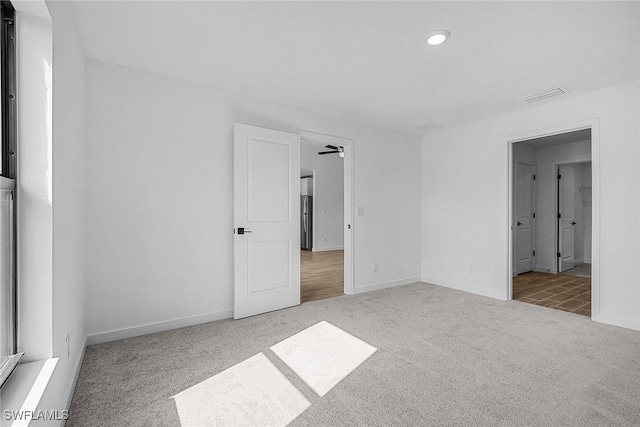 826 Yellowbird Dr, Fort Myers, FL 33913 - unfurnished bedroom with stainless steel refrigerator, visible vents, recessed lighting, carpet floors, and baseboards