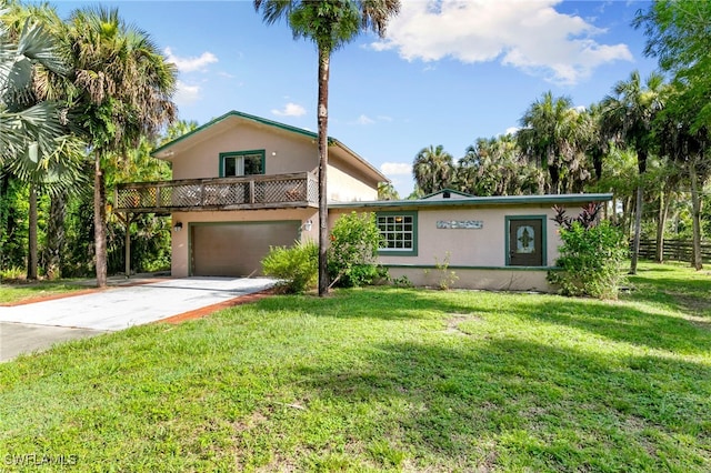 view of front facade with a garage and a front lawn