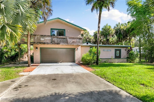 view of front facade with a front yard and a garage