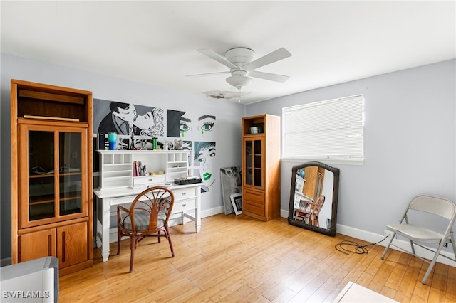 office space with light hardwood / wood-style flooring and ceiling fan