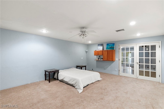 bedroom featuring french doors, carpet flooring, and ceiling fan