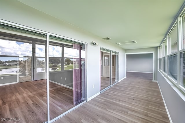 unfurnished sunroom with a wealth of natural light