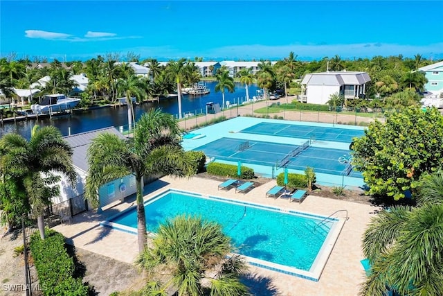 view of pool with a water view