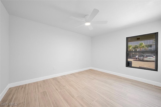 unfurnished room with ceiling fan