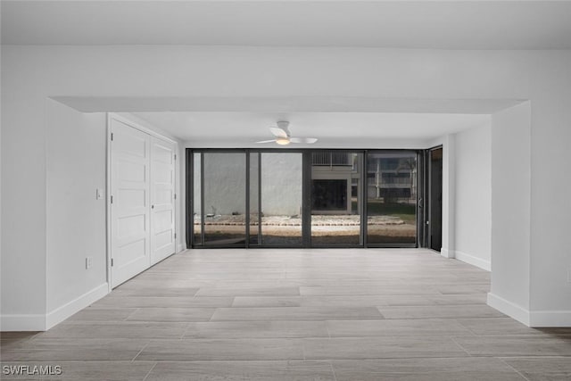 unfurnished room featuring ceiling fan and light hardwood / wood-style flooring