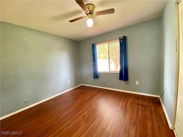 unfurnished room featuring a textured ceiling, ceiling fan, and wood-type flooring