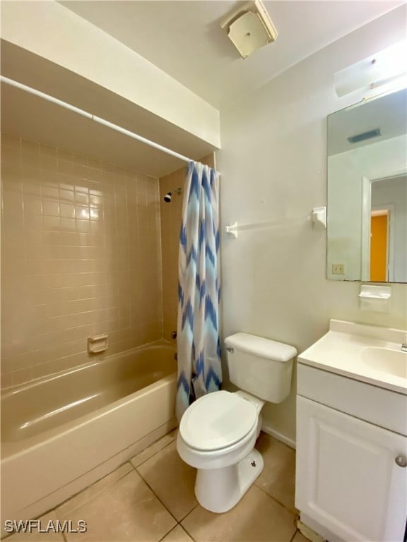 full bathroom with tile patterned flooring, vanity, shower / bath combo, and toilet