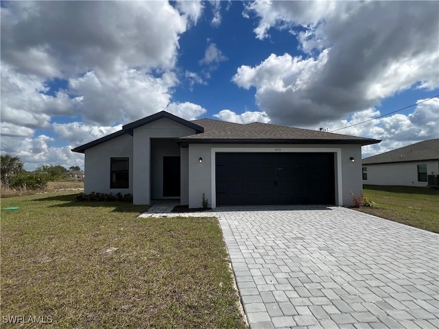 view of front facade featuring a garage, a front lawn, and central air condition unit