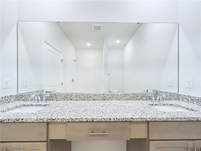 1057 Presque Isle Dr, Port Charlotte, FL 33952 - bathroom featuring visible vents, recessed lighting, tiled shower, and vanity