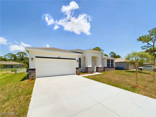 1057 Presque Isle Dr, Port Charlotte, FL 33952 - prairie-style house featuring stone siding, an attached garage, concrete driveway, a front lawn, and stucco siding