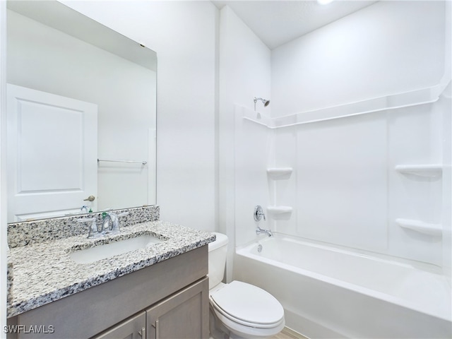 full bathroom featuring toilet, shower / bathing tub combination, and vanity