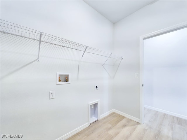 laundry room with washer hookup, electric dryer hookup, and light wood-type flooring