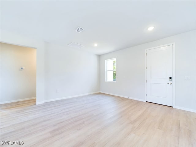 unfurnished room with light hardwood / wood-style flooring