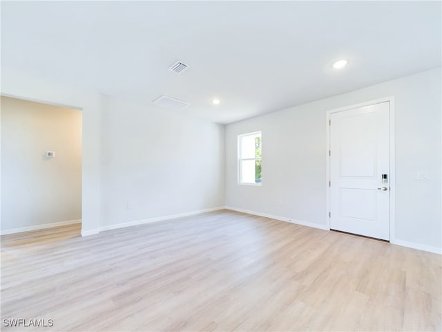 1057 Presque Isle Dr, Port Charlotte, FL 33952 - spare room with baseboards, visible vents, light wood-style floors, and recessed lighting