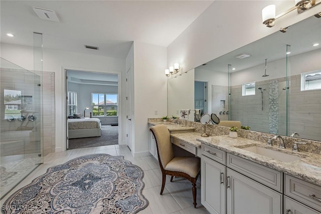 bathroom with visible vents, a shower stall, a wealth of natural light, and connected bathroom