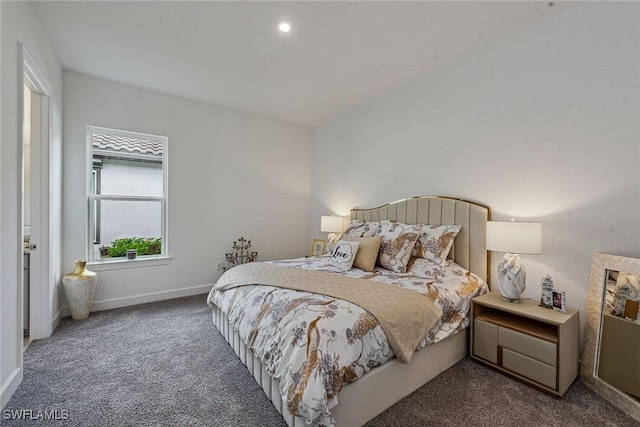 bedroom featuring carpet flooring and baseboards