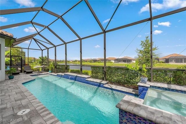 view of swimming pool with a pool with connected hot tub, glass enclosure, and a patio