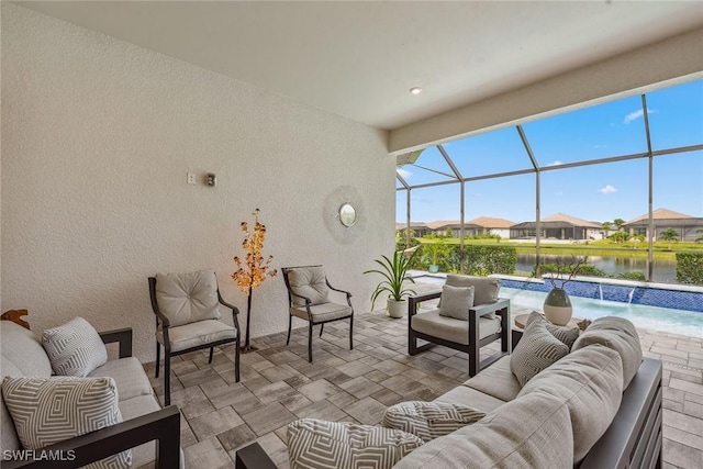 view of patio / terrace with glass enclosure, outdoor lounge area, an outdoor pool, and a water view