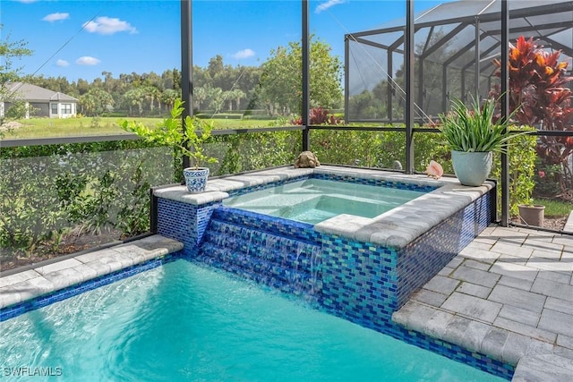 outdoor pool featuring a lanai, a patio, and an in ground hot tub