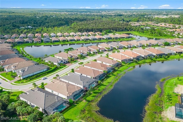 birds eye view of property featuring a water view and a residential view