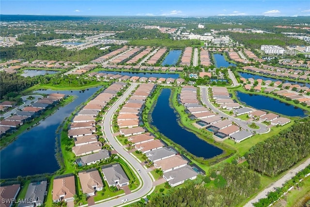 bird's eye view with a water view and a residential view