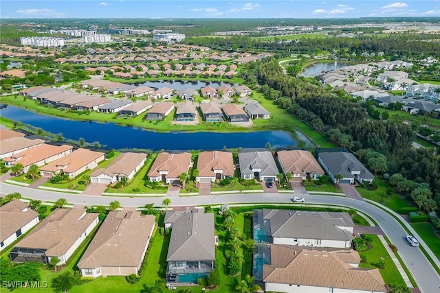 bird's eye view with a residential view and a water view