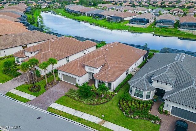 aerial view with a water view and a residential view