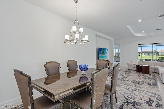 dining space featuring baseboards, recessed lighting, visible vents, and a notable chandelier