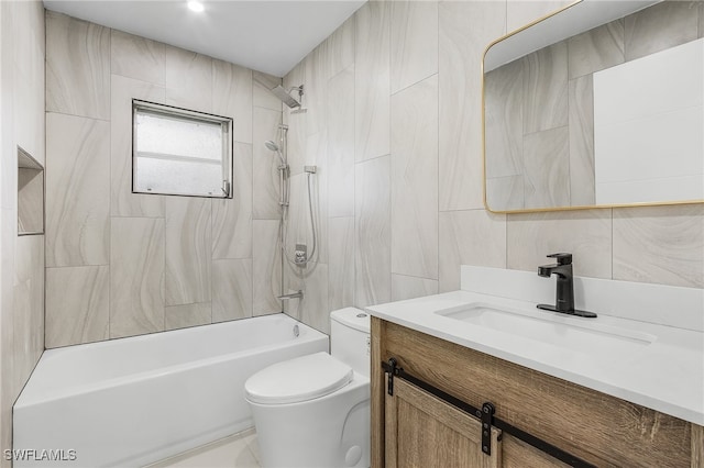 full bathroom featuring vanity, tile patterned floors, tile walls, toilet, and tiled shower / bath combo