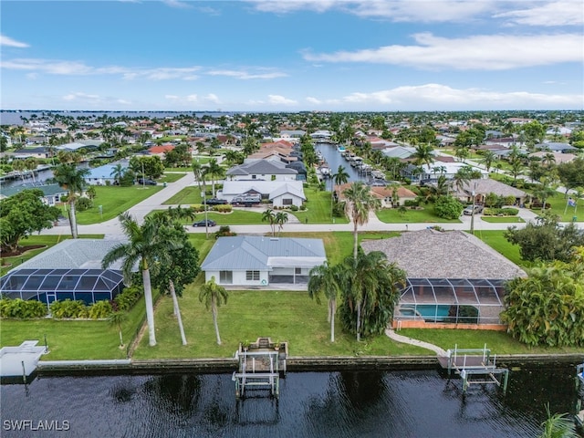 drone / aerial view with a water view