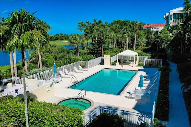 view of swimming pool with a patio area, a gazebo, and a hot tub