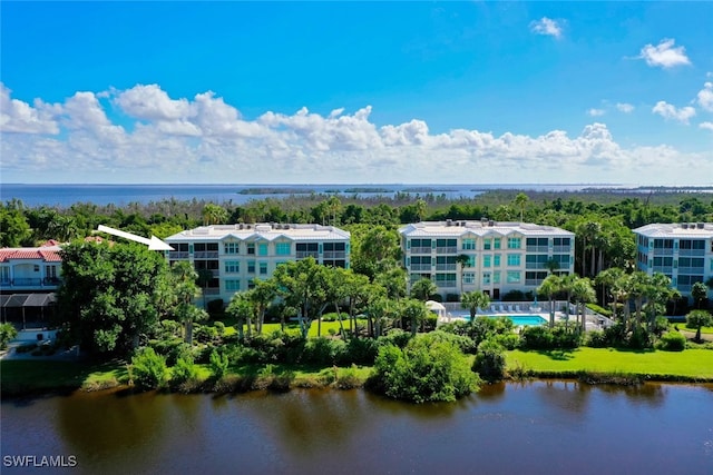 birds eye view of property with a water view