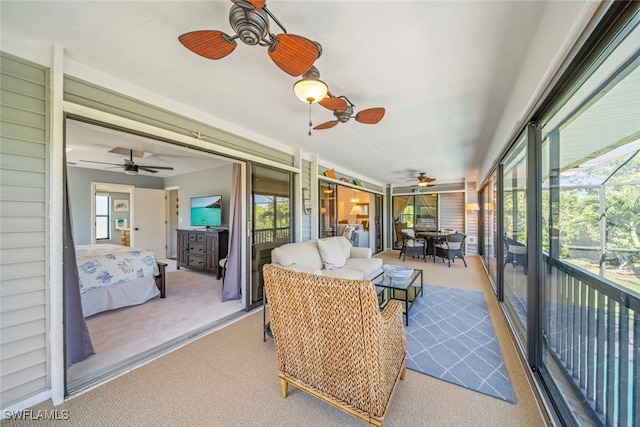 sunroom / solarium with ceiling fan and a wealth of natural light