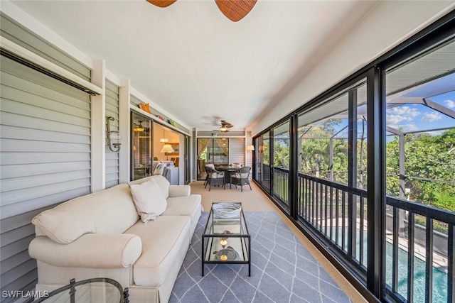 sunroom with ceiling fan