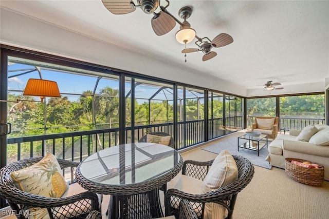 sunroom / solarium with ceiling fan and a wealth of natural light