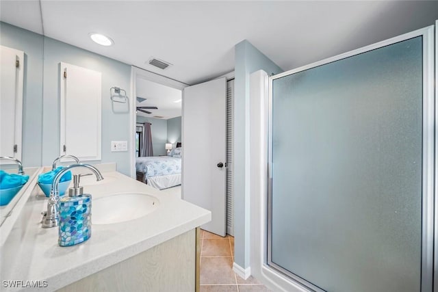1610 Sabal Sands Rd, Sanibel, FL 33957 - ensuite bathroom with visible vents, tile patterned flooring, ceiling fan, a shower stall, and connected bathroom