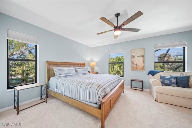 bedroom with light carpet and ceiling fan