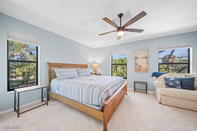 1610 Sabal Sands Rd, Sanibel, FL 33957 - carpeted bedroom with ceiling fan, baseboards, and multiple windows