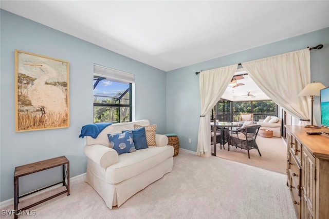 living area featuring light colored carpet