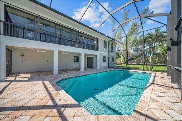 1610 Sabal Sands Rd, Sanibel, FL 33957 - outdoor pool with a patio, a ceiling fan, and glass enclosure