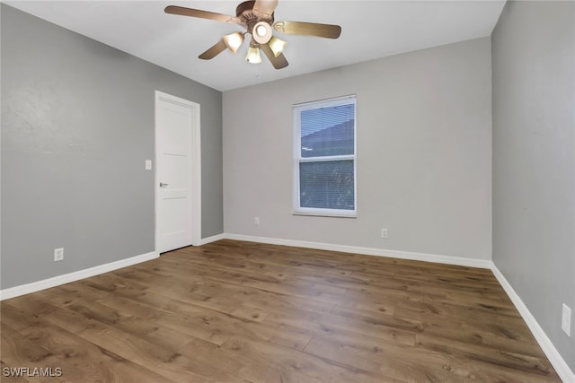 spare room with ceiling fan and hardwood / wood-style floors