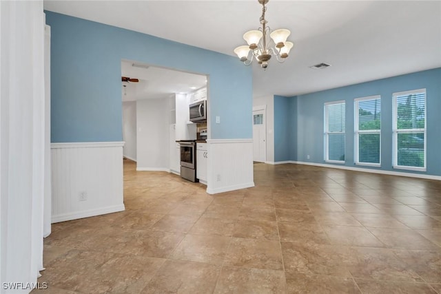 interior space with ceiling fan with notable chandelier